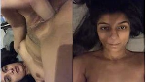 A horny girl with a big black dildo.