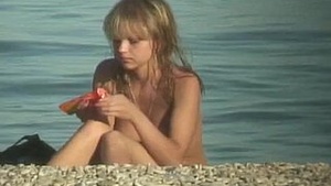 A nudist teenager sunbathing
