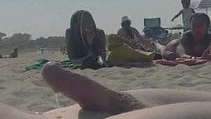 Dude showing his member at the public beach and it's hot