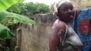 an african newborn baby takes a bath