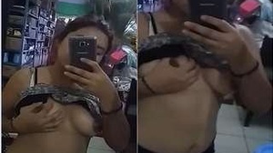 Pretty Girl Takes a Video With Her Breasts