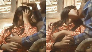 Lovers explore their desires with passionate kissing and presing in a cozy setting