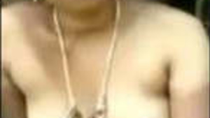 A Telugu auntie secretly walks with a dewar outdoors