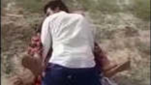 Two men have sex with a Rajasthani woman in an open field