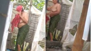 Exclusive Part of Desi Auntie Bathing Behind the Door