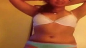 Young housewife with a big booty strips and gets naked in this steamy video