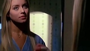 Italian beauty Gloria Guida strips down to sexy sheets