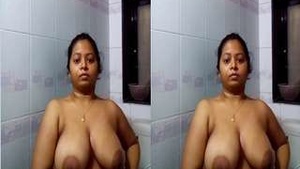 Exclusive Video of a Horny Woman Showing Off Her Large Breasts