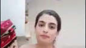 Desi bhabhi flaunts her ample assets while masturbating and licking herself