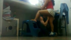 Amateur babe gets her pussy eaten out behind the office desk