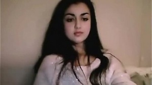 A stunning Indian girl with a camera captures her undressing and satisfying fans in this sexy video