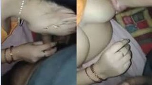 Exclusive video of a village wife giving a blowjob while pressing her breasts