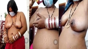 Mature Indian housewife puts on a wild striptease show for the camera