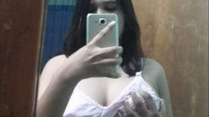 Beautiful sexy teen girl showing her big tits