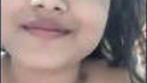 Amateur Girl Teases with Her Big Breasts in a Steamy Video