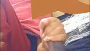 Naughty girlfriend gives a handjob to her boyfriend in front of him