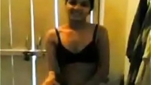 An Indian woman exposing her private parts and removing her clothing.