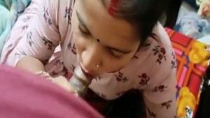 Indian housewife indulges in a steamy oral sex session on camera