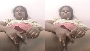 Indian bhabhi pleasures herself with her fingers in this video
