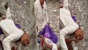 Elderly man caught in the act of arousedness in a desolate backyard