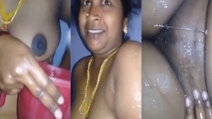 Tamil auntie gets naked in the bath for a steamy MMS video