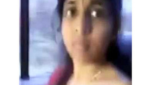 Tamil babe with big breasts shows off in a moving car