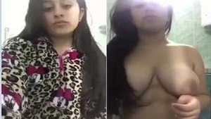Exclusive video of a sexy girl stripping down and flaunting her big boobs