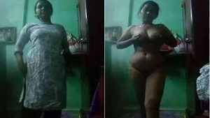 Exclusive video of a horny Bhabhi stripping and flaunting her big tits