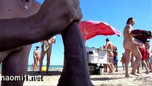 sucking a big dick on a public beach