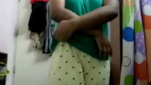 Woman undressing and playing with tiny tits for a guy