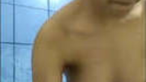 Beautiful pretty girl undressing in the bathroom