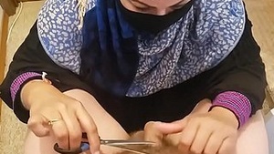 Arabian mom gives pedicure combined in ambient trim surrounding clamping
