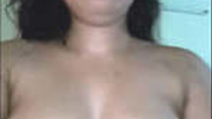 Pretty girl showing and playing with breasts