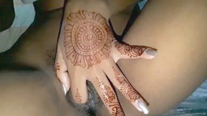 Horny girl fingering her juicy pussy in mehendi hand