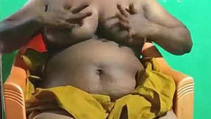 horny vanitha aunt showing big tits and shaved pussy sex using red candle