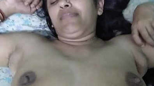 Aunty has good big melons and likes to pleasure herself.