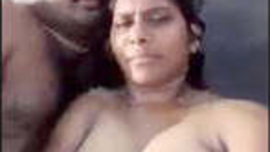 A young Indian couple enjoys an intimate moment at the beach.