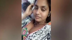 An Indian girl shows her cleavage while chatting.