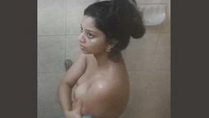Stepbrother caught beautiful Indian girl in a bath and took explicit photos.