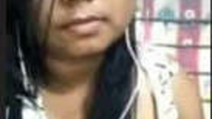 A sensual Assamese woman revealing her breasts and vagina in a video call.