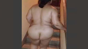 Indian auntie Tia stripping on the stairs