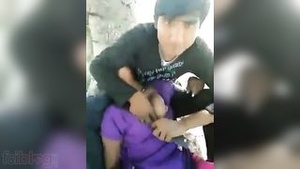 A sexy Indian woman gets hot and steamy in an outdoor scene with the men who support her in the movie.