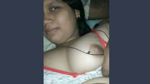 Hot Indian wife showing off her large breasts.