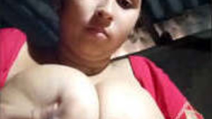 A very horny woman showing her big breast and hairy vagina.