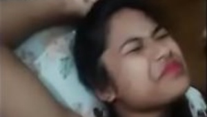 Young Filipina girl gets help from her friend in a dare样的 highway stop.