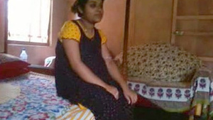 The Bhabi is revealing her breasts to the Devar in her house.