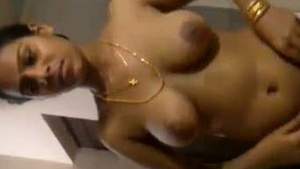 Self-syled aunty strips and gives a great blow job to her lover.