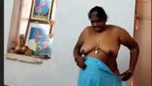 Moderate dressed Tamil auntie in action