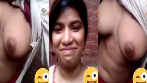 Young woman from Karachi displaying her breasts during a video call