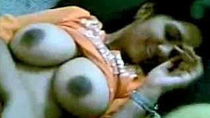 Big-boobed girl gives blowjob to her boyfriend with The Light Band.